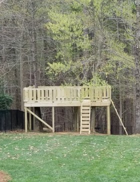 9x12 Tree Deck with steps and rockwall