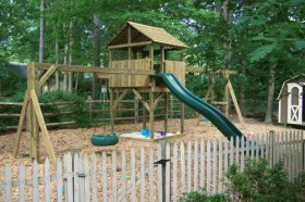 6x6 wooden playset in Cary with added height to deck and roof