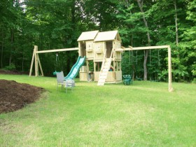 Split Level Fort with great playhouse below, on difficult slope.